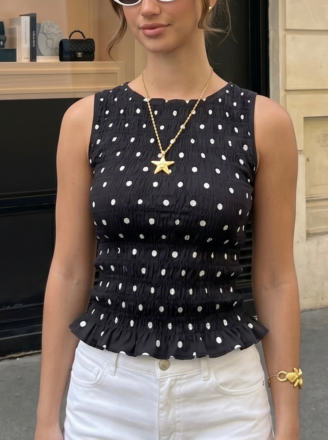 Top sans manches smocké à pois