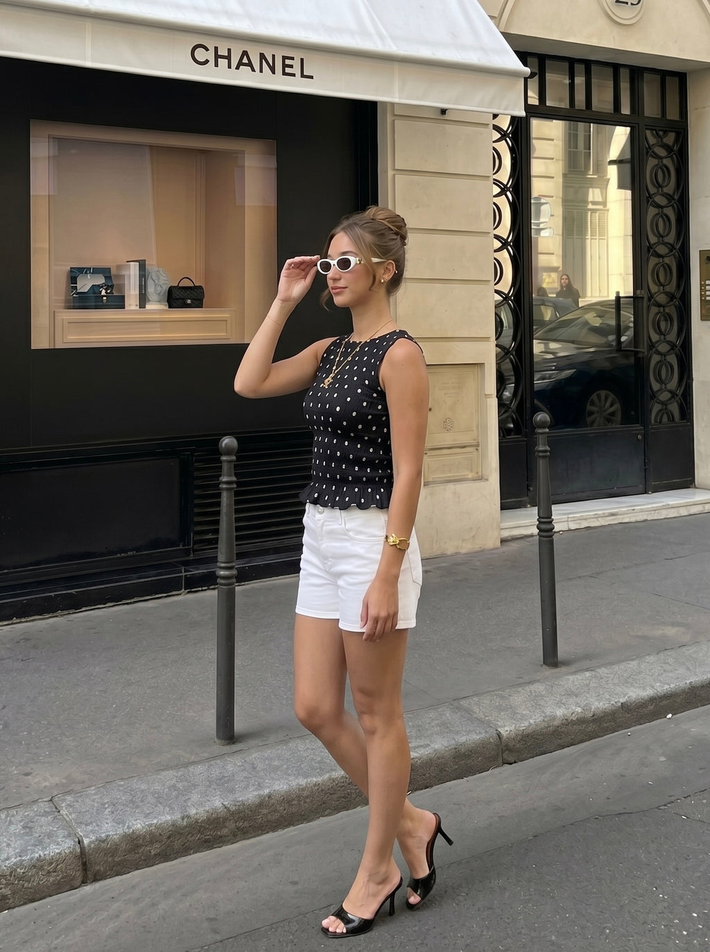 Top sans manches smocké à pois